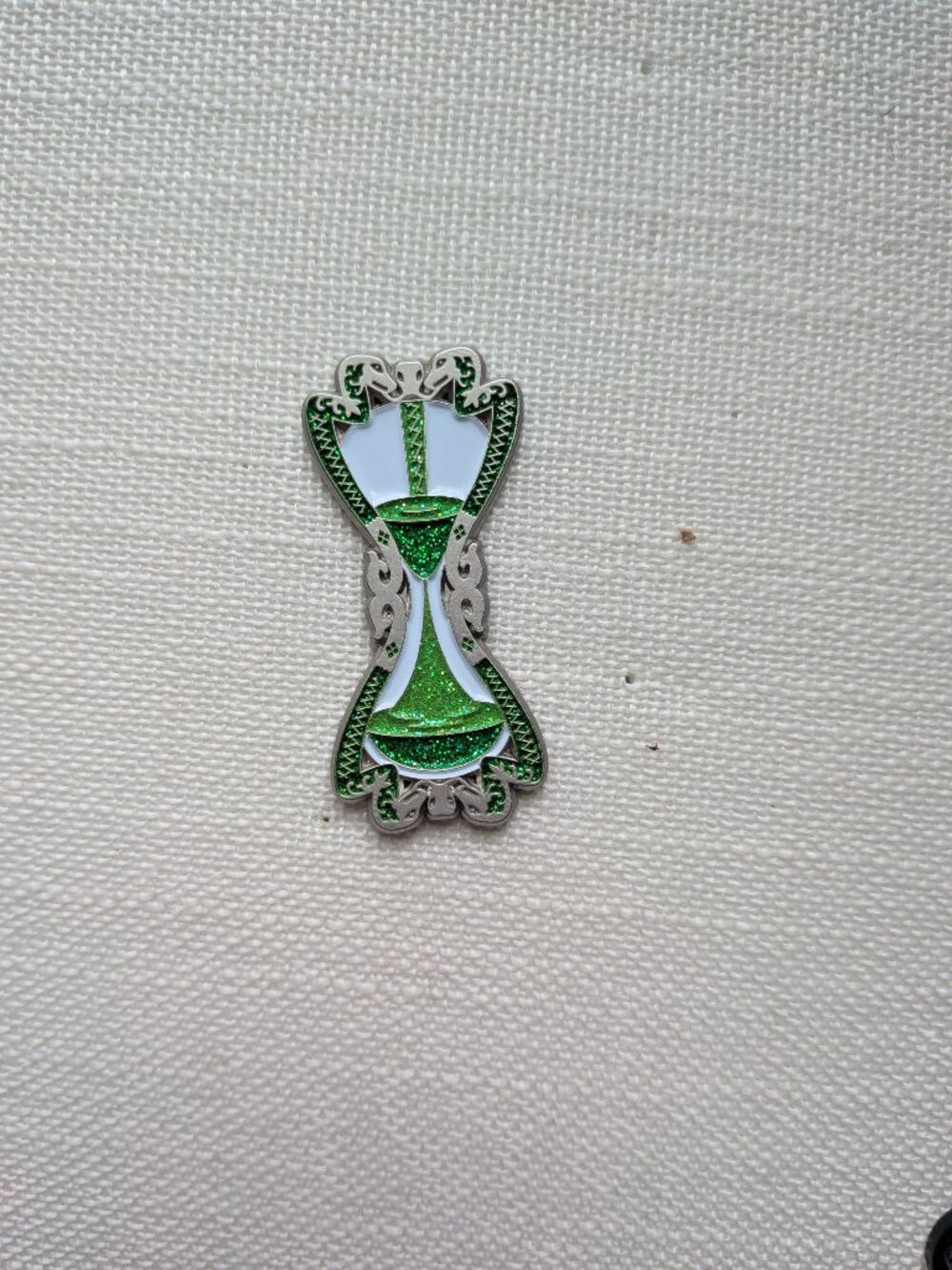 Slughorn's Hourglass Pin